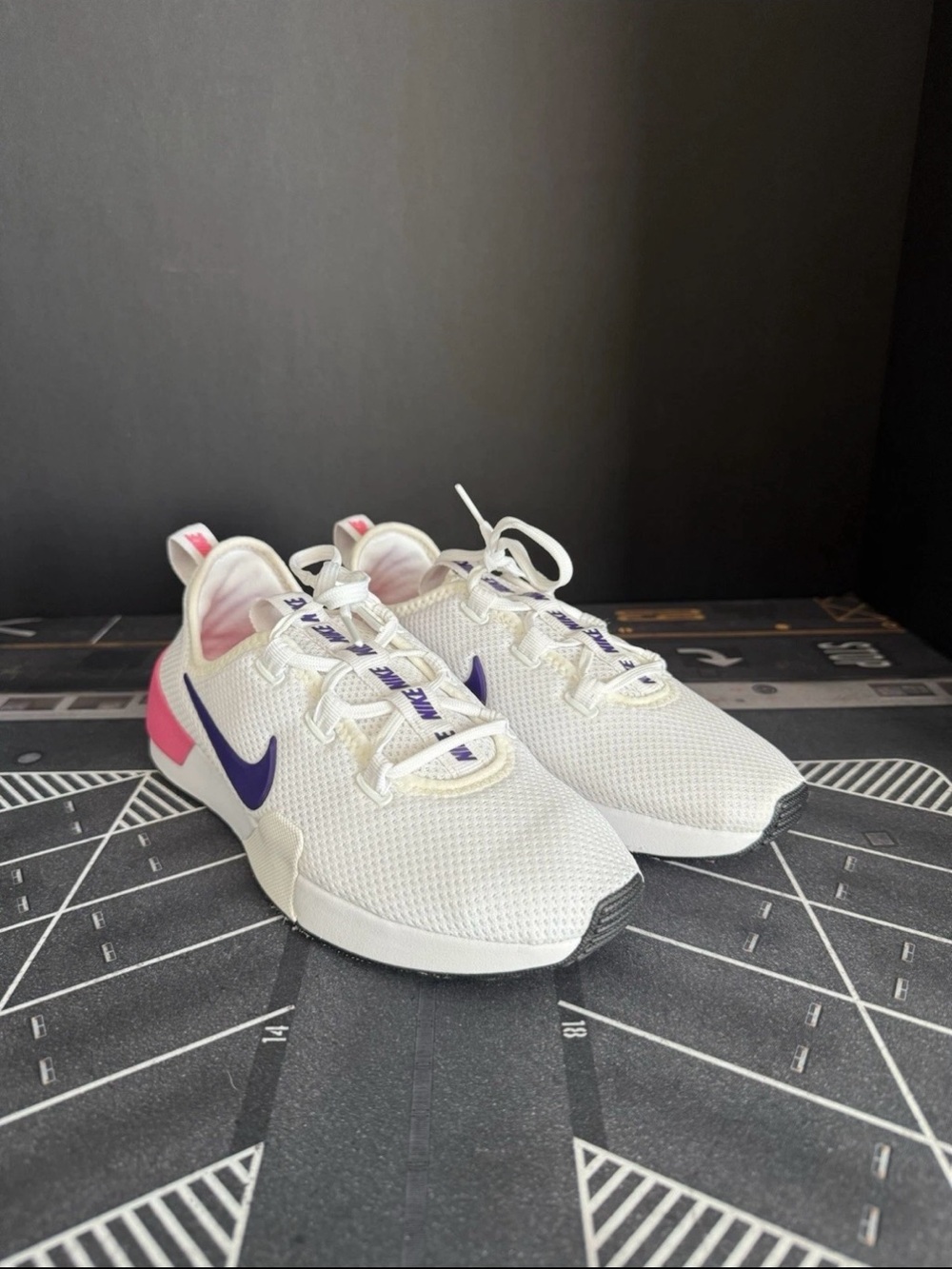 Nike Women’s White Sneakers with Purple Swoosh and Pink Heel Accent